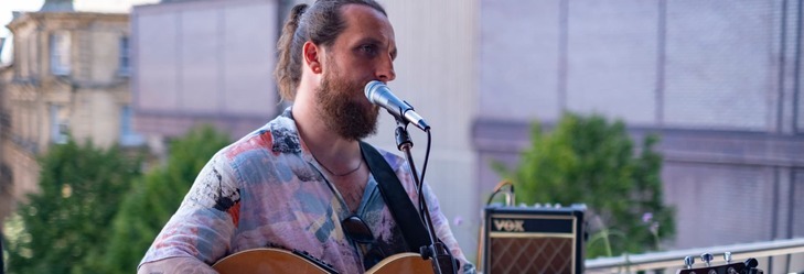 Performer on the Darley St Market balcony