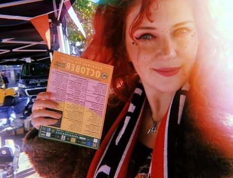Charlotte holding a printed gig list