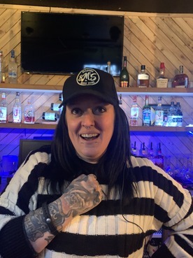 Supporter wearing a Bradford Music Scene cap in a Bradford venue