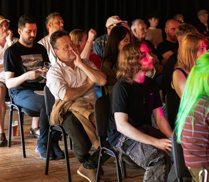 A full room of people at a Let's Make a Scene event